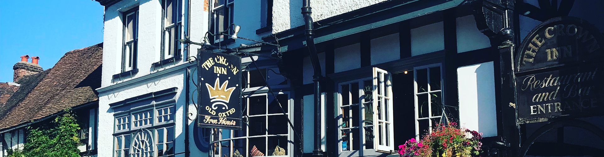 The black-and-white timbered frontage of The Crown Inn